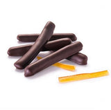 strips of candied orange lay on a white background overlayed with chocolate-dipped candied orange